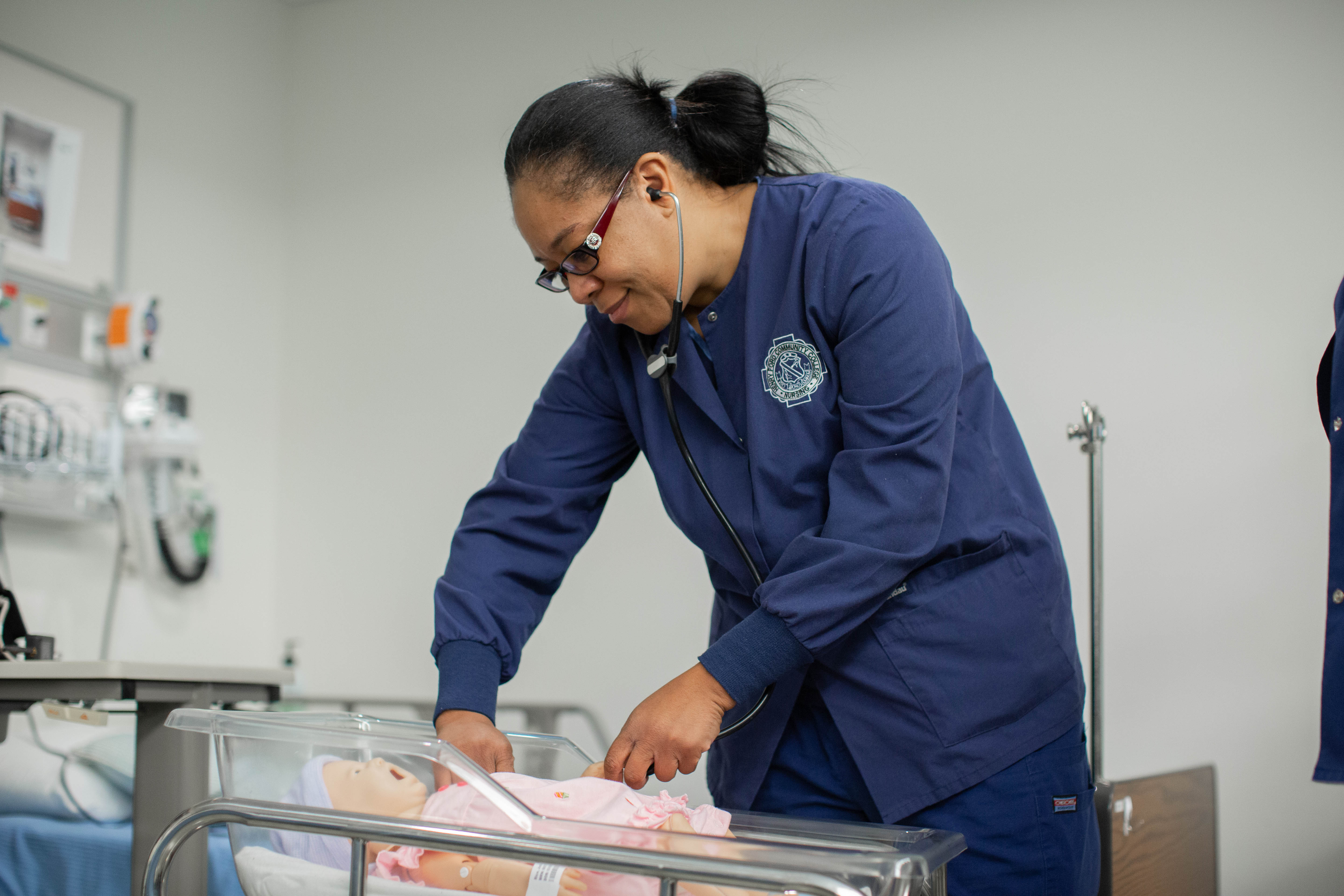 Woman operates on baby doll